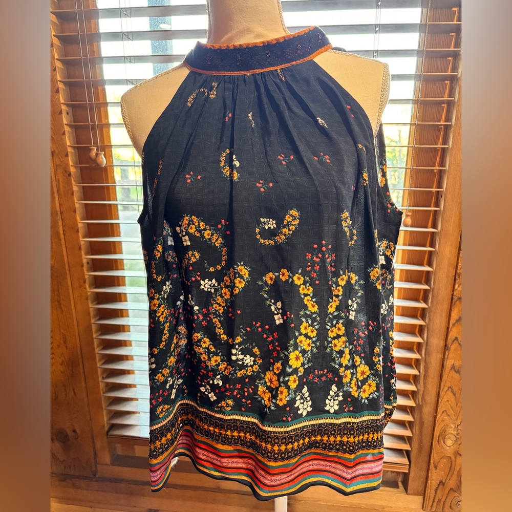 Beautiful, sleeveless blouse with beading.